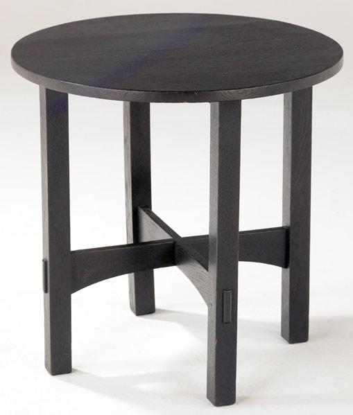 Appraisal: GUSTAV STICKLEY Ebonized tea table with circular top and arched