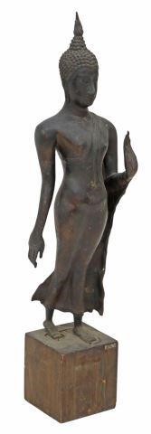 Appraisal: Patinated bronze walking figure of the Buddha Thailand tightly curled