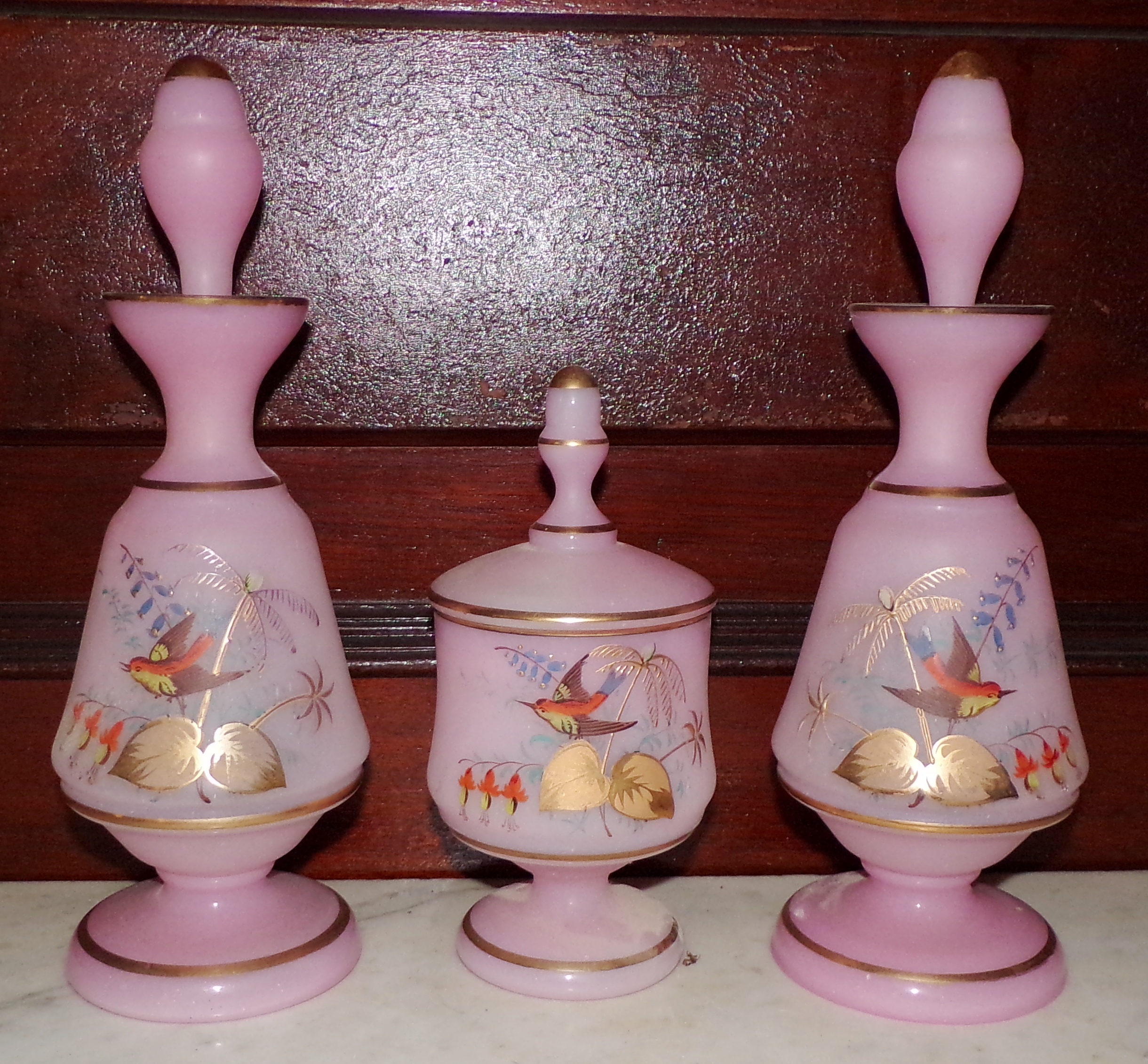 Appraisal: -Pc Pink glass vanity set- bottles and covered jar decorated