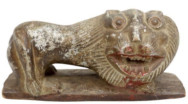 Appraisal: Carved lion figure remnants of silver gilt paint and red