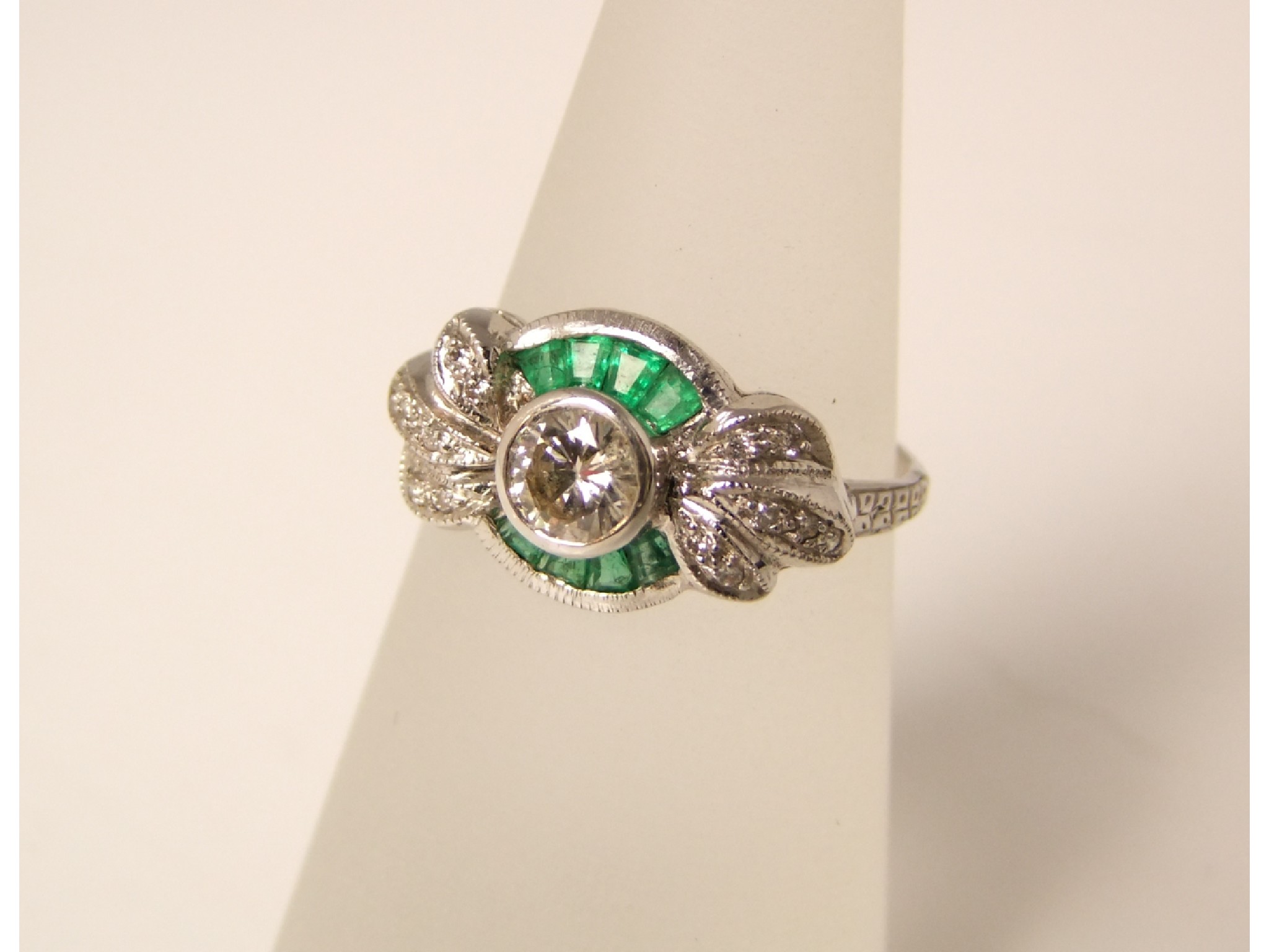 Appraisal: An ct white gold emerald and diamond ring the central