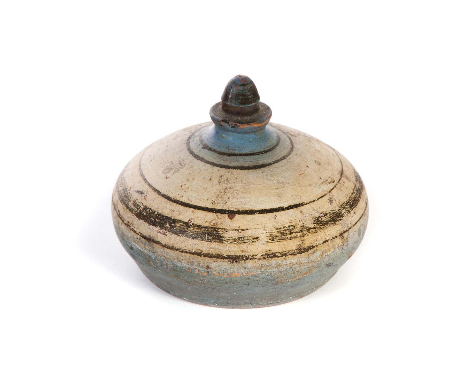 Appraisal: STONEWARE DOORSTOP Nineteenth century Paint decorated with acorn finial and