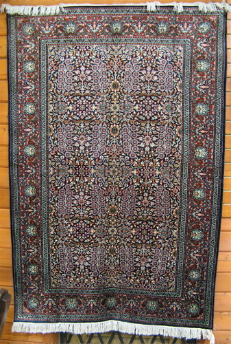 Appraisal: ORIENTAL AREA RUG hand knotted overall floral decoration on dark