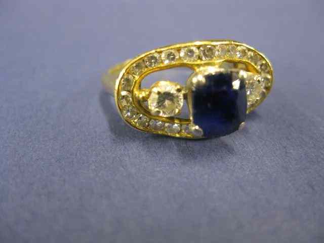 Appraisal: Sapphire Diamond Ring deep bluecushion cut carat gem surrounded by