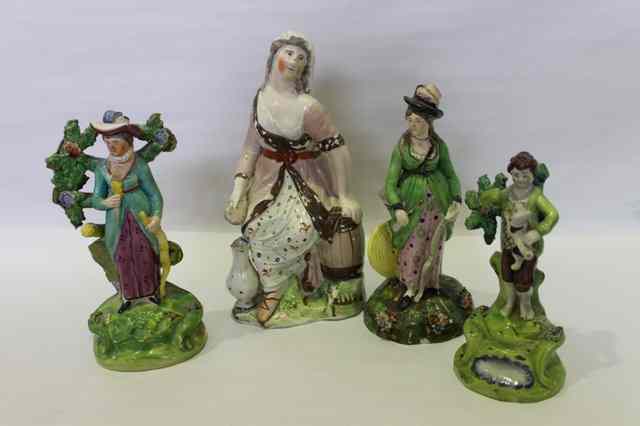 Appraisal: A COLLECTION OF FOUR EARLY STAFFORDSHIRE POTTERY FIGURES in the