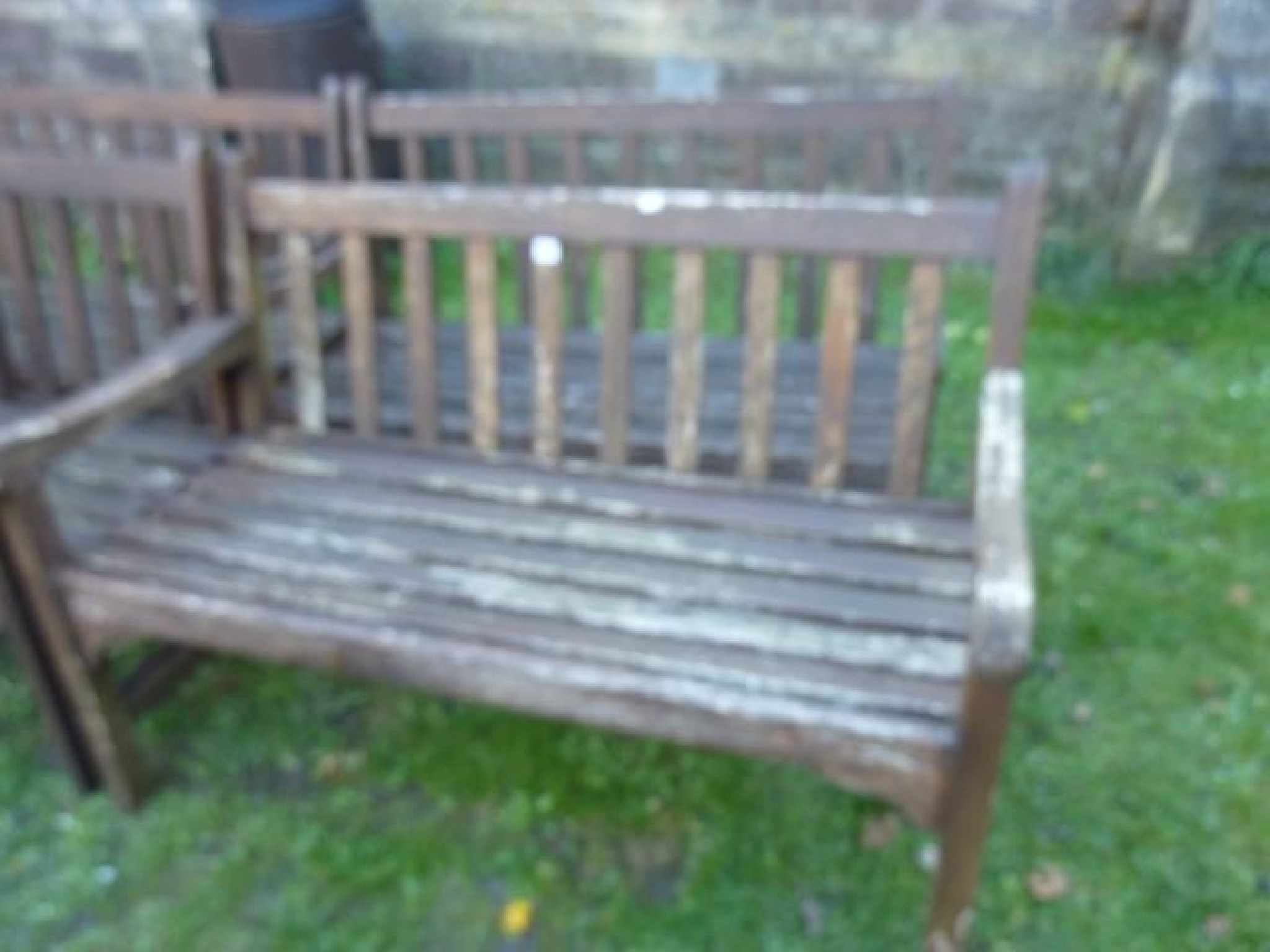 Appraisal: Two similar weathered hardwood two seat benches with slatted seats