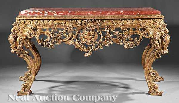 Appraisal: A Pair of Monumental Carved and Gilded Consoles each with