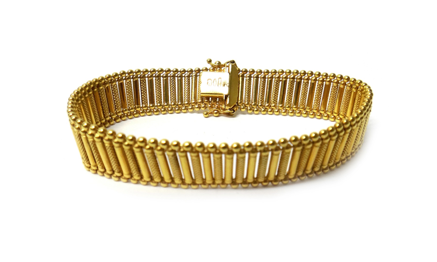 Appraisal: A ct gold bracelet in an alternating decorated and plain