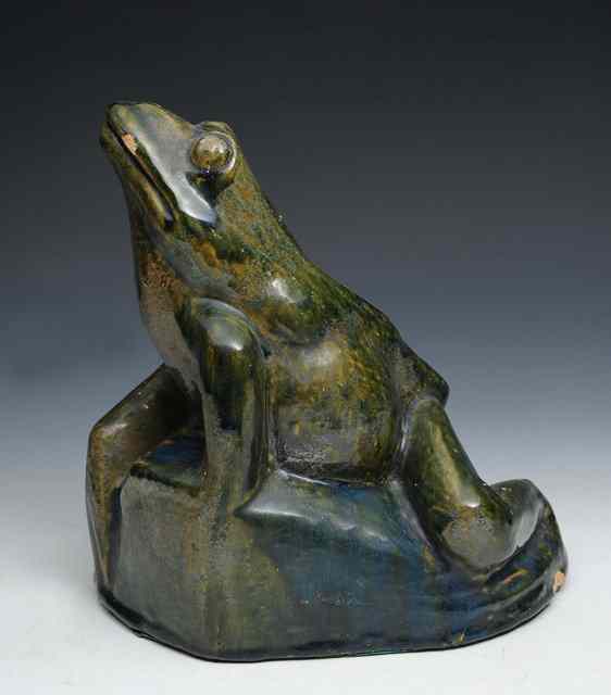 Appraisal: An Arts Crafts green glazed model of a frog in