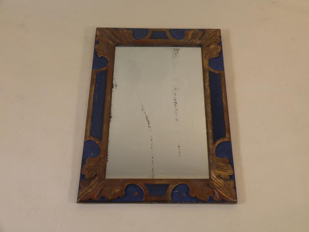 Appraisal: A continental wall mirror the moulded frame decorated with leaves