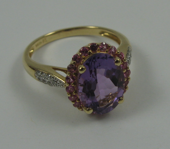 Appraisal: AMETHYST PINK SAPPHIRE AND K GOLD RING centering an oval-cut