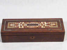 Appraisal: A rosewood box with inlaid brass stringing and panel of