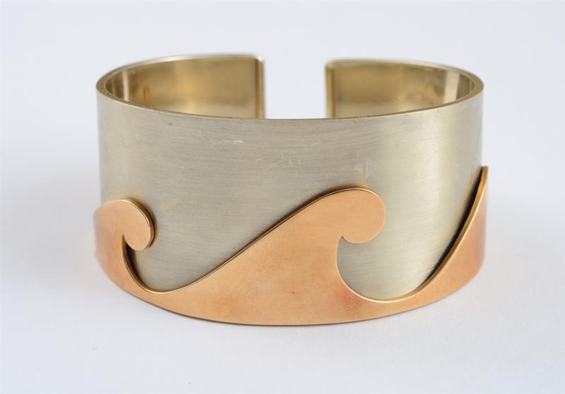 Appraisal: BRUSHED STEEL AND K GOLD BANGLE BULGARI Tapered open bangle