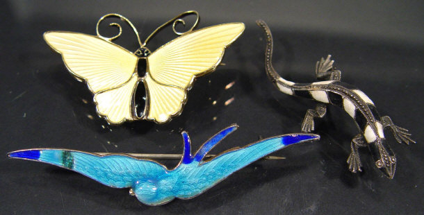 Appraisal: Silver and enamel lizard brooch a silver enamel bluebird brooch