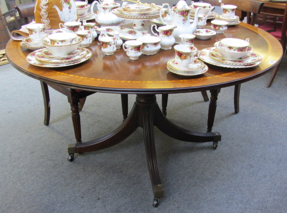 Appraisal: A George III style circular supper table the rosewood and