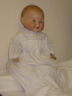 Appraisal: An Armand Marseille bisque head baby doll with pale blue