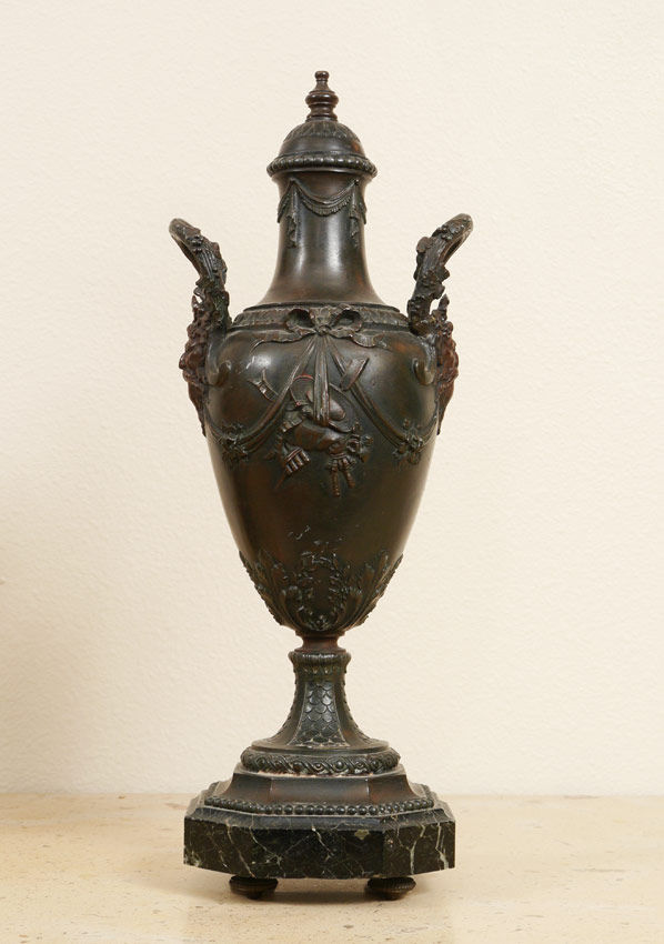 Appraisal: BRONZED ORNAMENTAL URN Ornamental urn on octagonal black marble vase