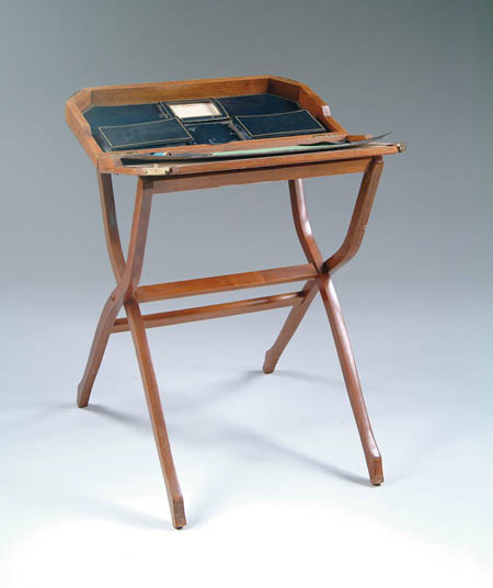 Appraisal: FOLDING BEDSIDE DESK This bedroom accessory has a luggage rack