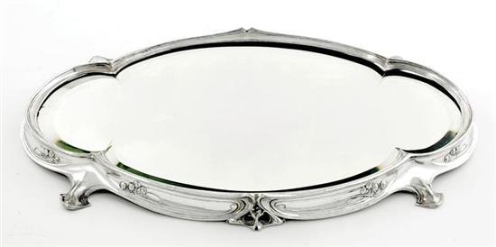 Appraisal: Art Nouveau silverplate plateau circa shaped beveled mirror supported on