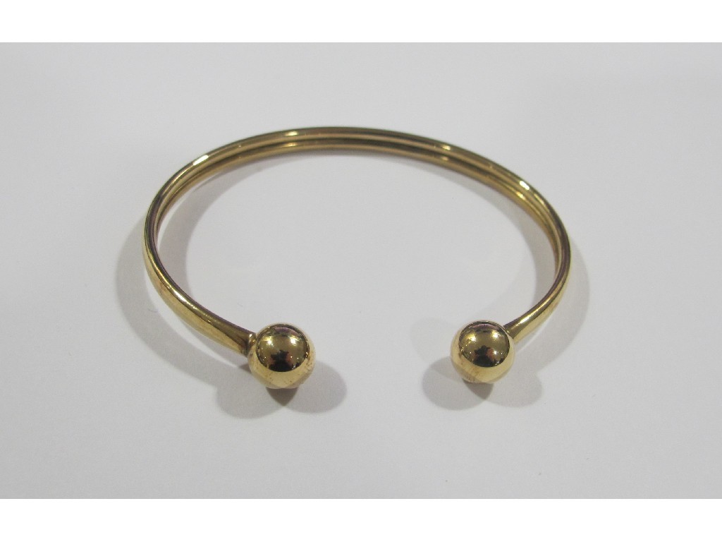 Appraisal: Nine carat gold torc bangle Approximately gms