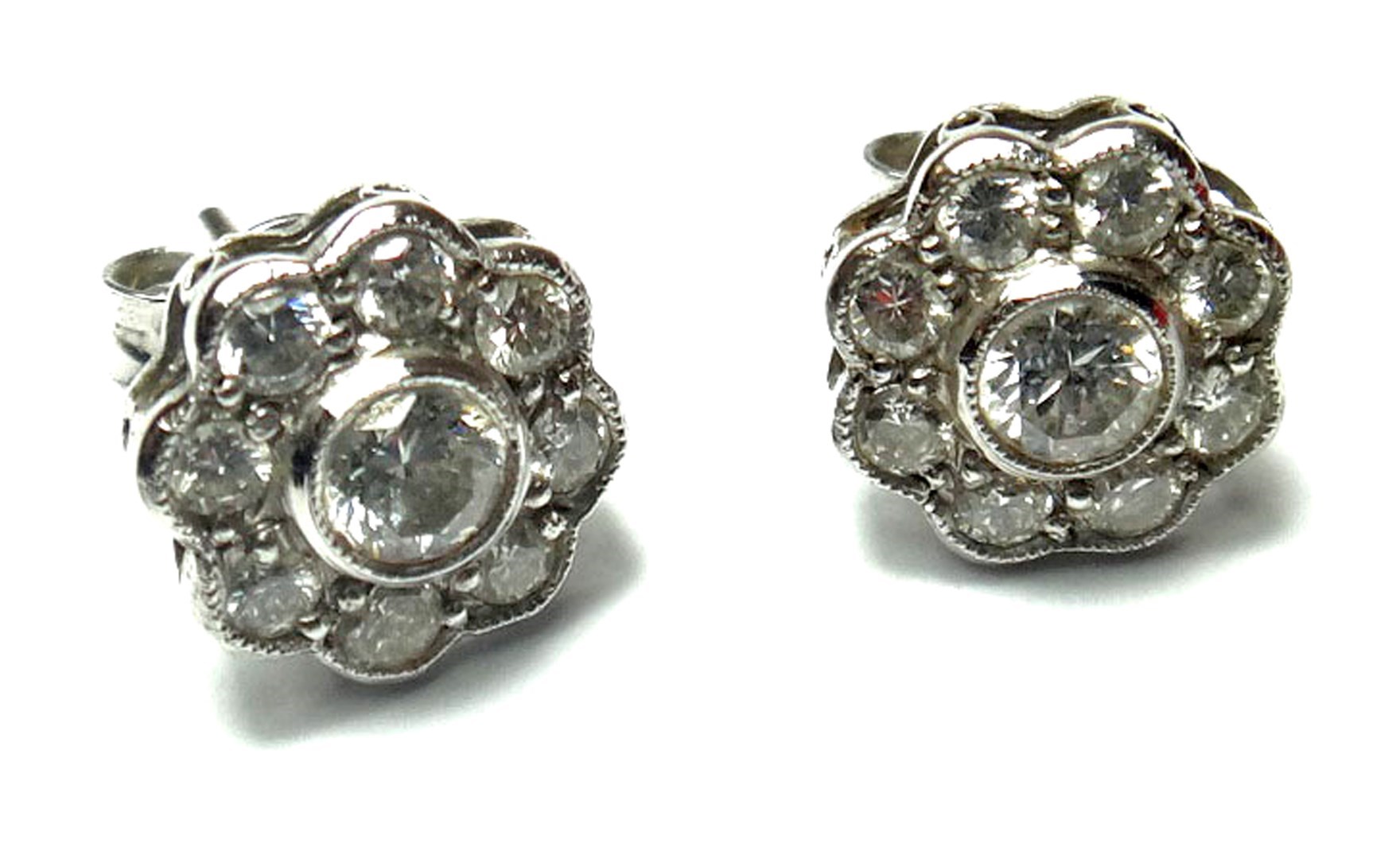 Appraisal: A pair of white gold and diamond set cluster earstuds