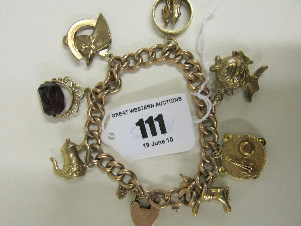 Appraisal: Nine carat gold charm bracelet with seven various gold charms