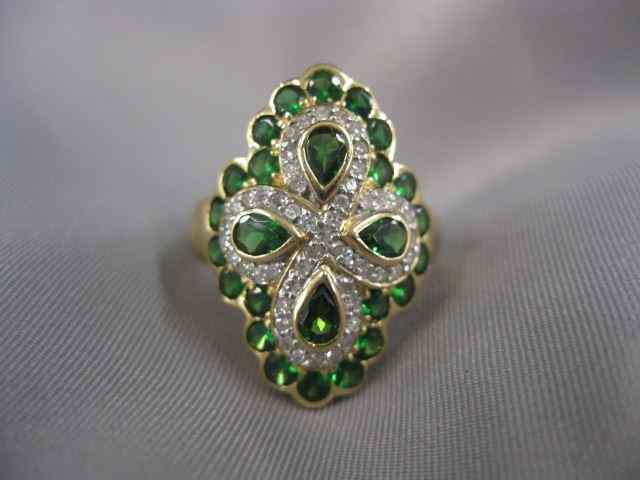 Appraisal: Tsavorite Garnet Diamond Ring four rich pear shaped gems with