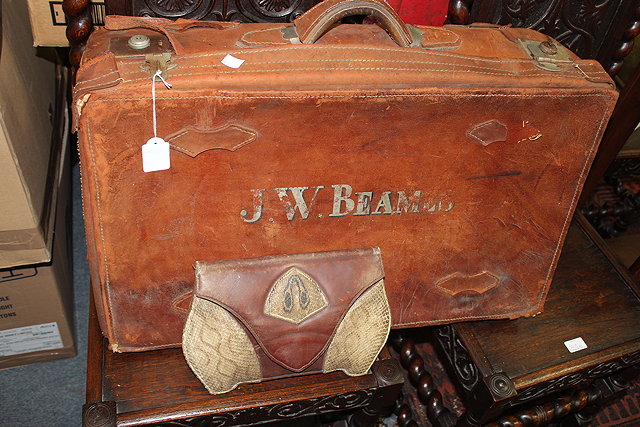 Appraisal: AN EARLY TH CENTURY BROWN LEATHER SUITCASE wide together with