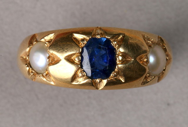 Appraisal: A THREE STONE SAPPHIRE AND PEARL SET DRESS RING star