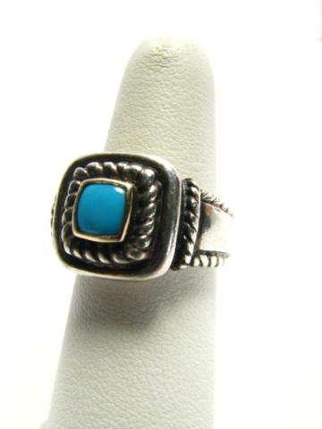 Appraisal: Silver K yellow gold ring with turquoise bezel set stone