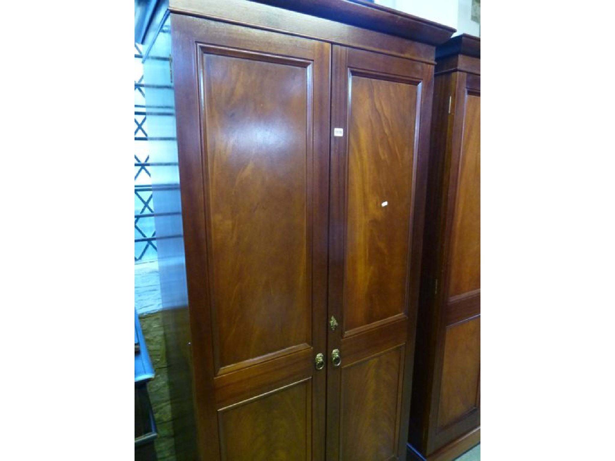 Appraisal: A good quality contemporary mahogany wardrobe in the Georgian style