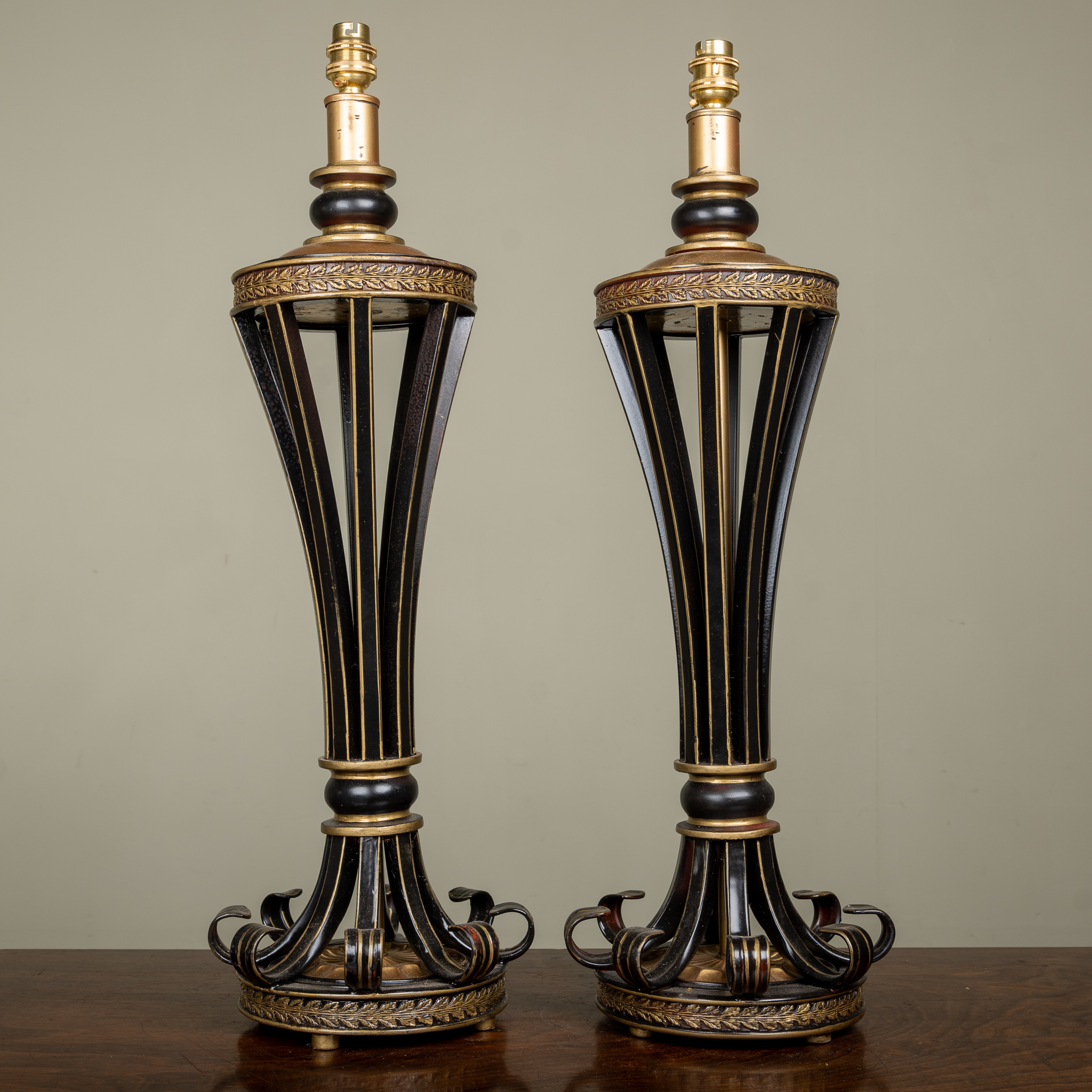 Appraisal: A pair of modern black and parcel gilt painted table