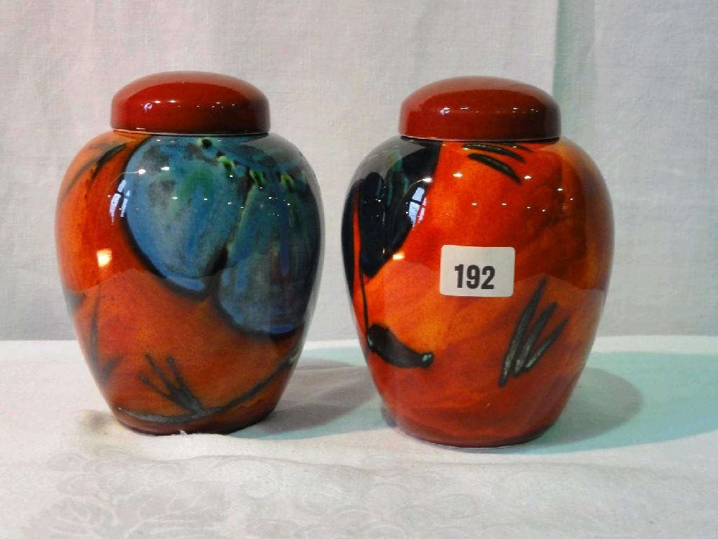 Appraisal: A pair of Poole Pottery ginger jars and covers in