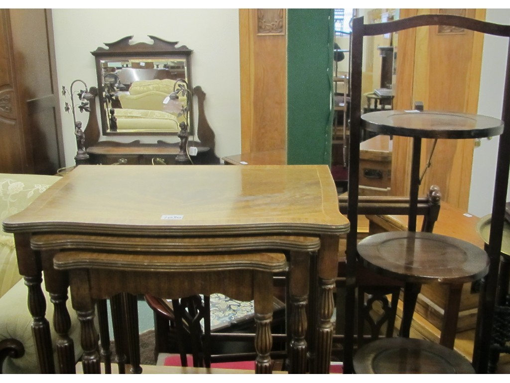 Appraisal: Nest of three tables cakestand serving tray Eastern brass top