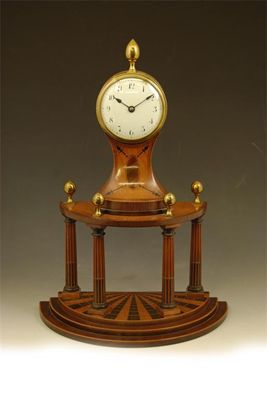 Appraisal: A th century continental satinwood mahogany and parquetry mantel clock