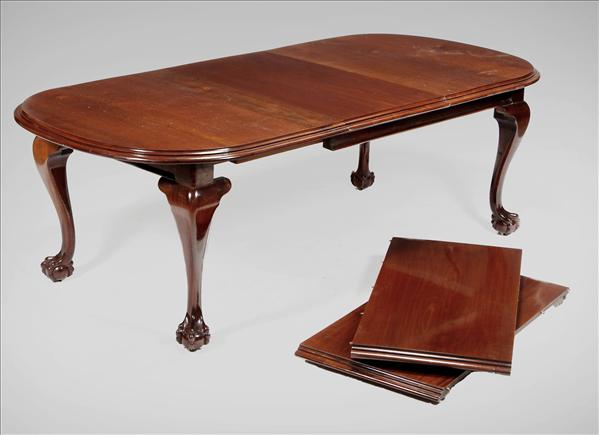 Appraisal: A mahogany extending wind-out dining table in George III style