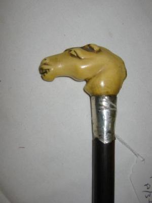 Appraisal: A WALKING STICK the ivory grip modelled as a horse's