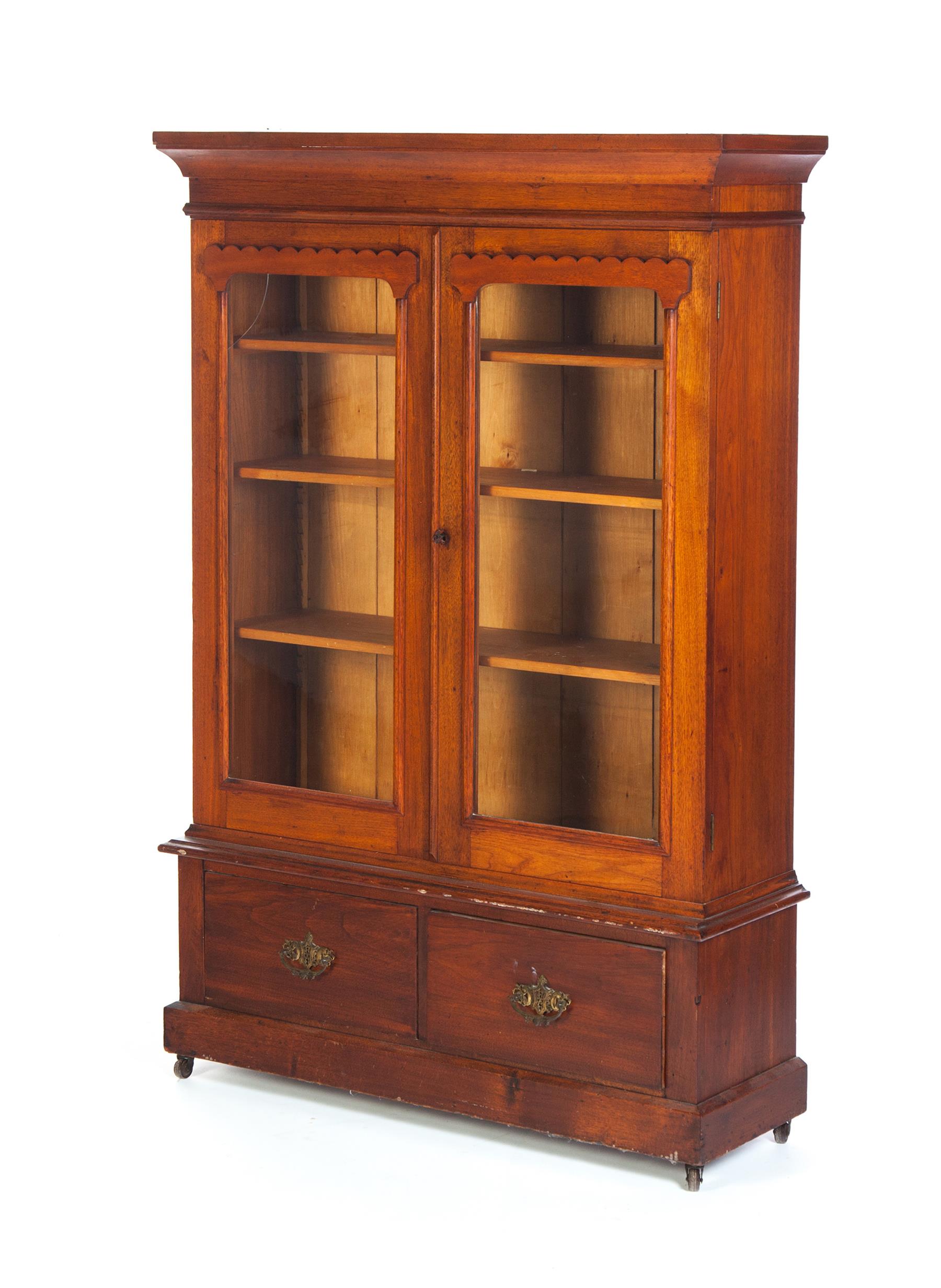 Appraisal: VICTORIAN LIBRARY BOOKCASE American th quarter- th century walnut Coved