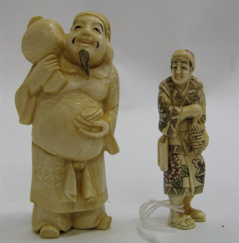 Appraisal: TWO HAND CARVED IVORY FIGURES One of a gentleman carrying