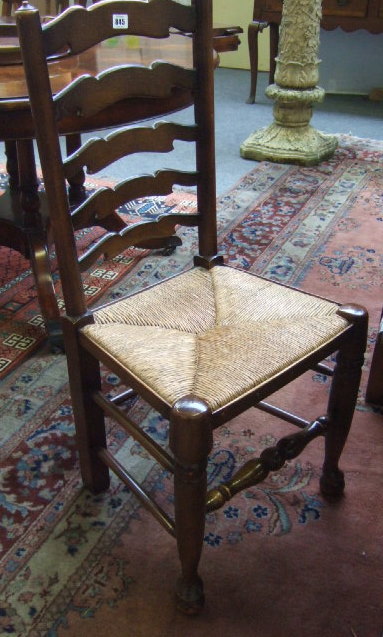 Appraisal: A set of four th century elm ladder back dining