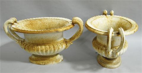 Appraisal: PAIR OF CAST IRON TWO-HANDLED GARDEN URNS The low bulbous