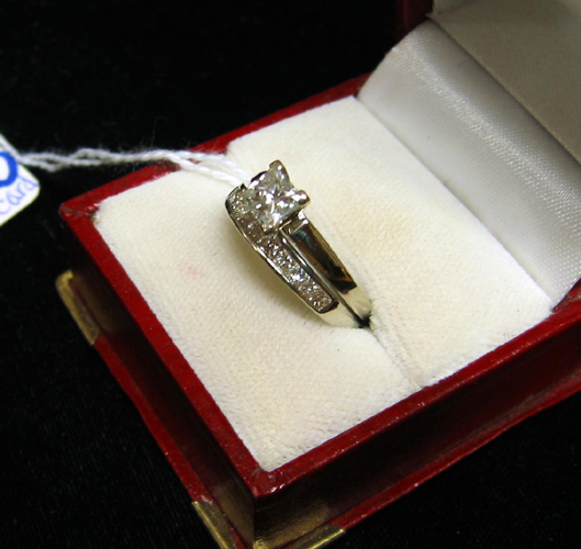 Appraisal: DIAMOND AND FOURTEEN KARAT WHITE GOLD RING WITH DIAMOND APPRAISAL