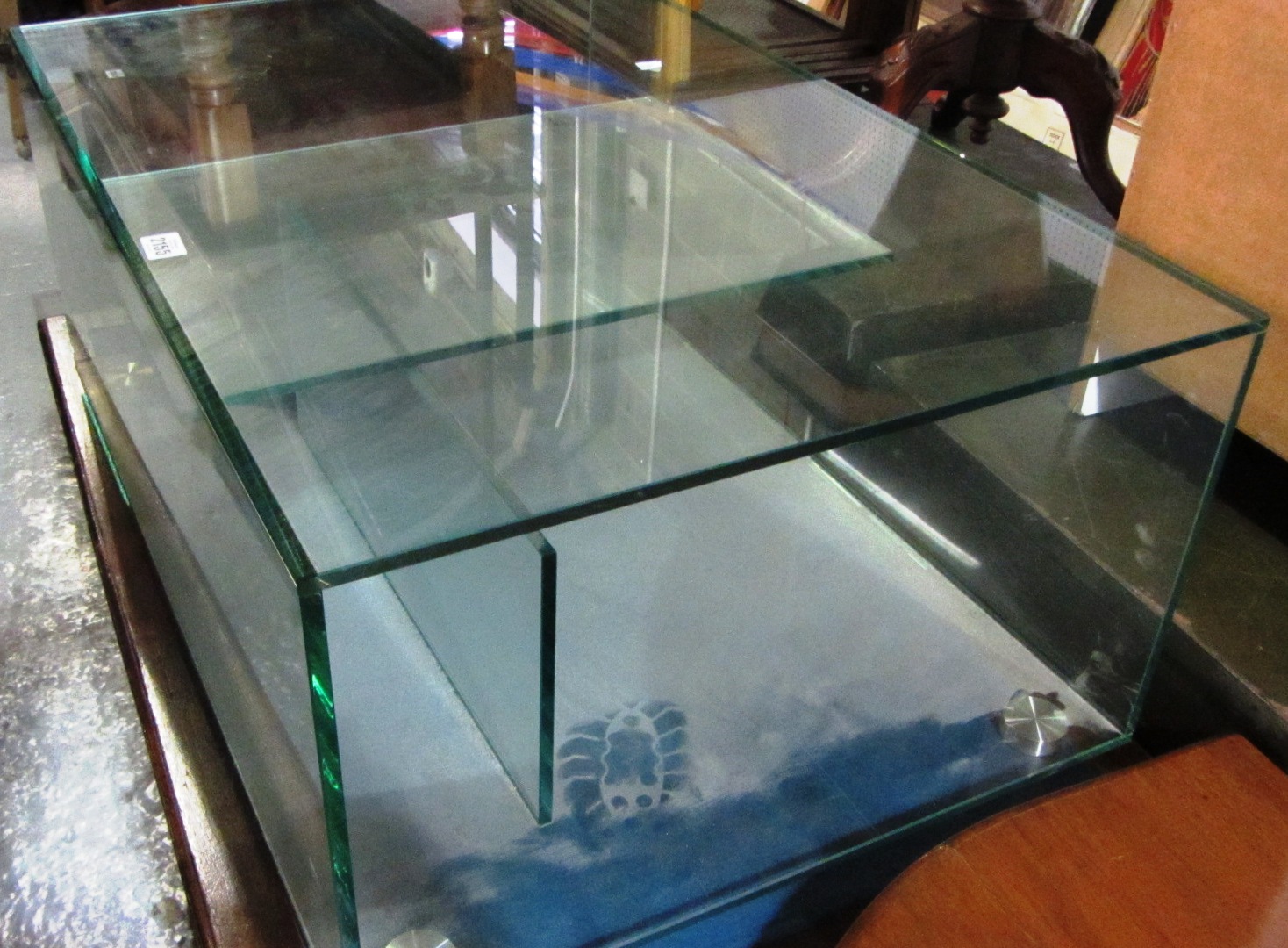 Appraisal: A th century glass coffee table