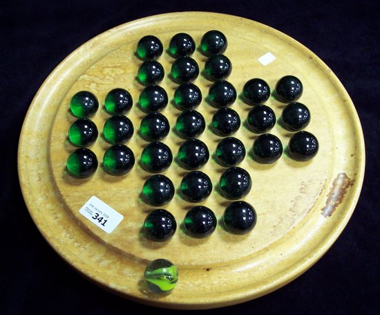 Appraisal: A solitaire board set thirty-three green marbles