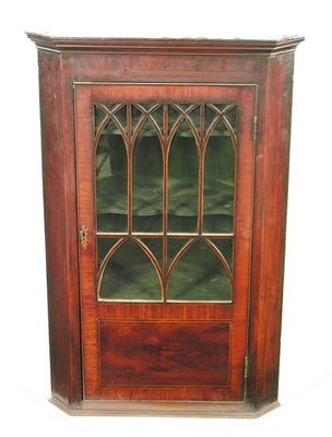 Appraisal: An early th century mahogany hanging corner cupboard with boxwood