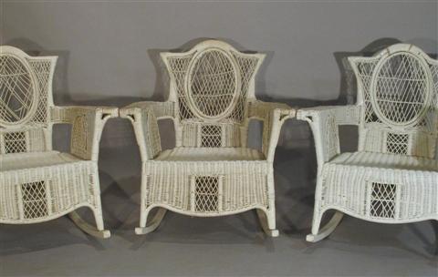 Appraisal: SET OF THREE WHITE WICKER ROCKING CHAIRS Early-mid th century