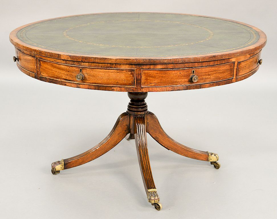 Appraisal: George III mahogany drum table with tooled leather green top