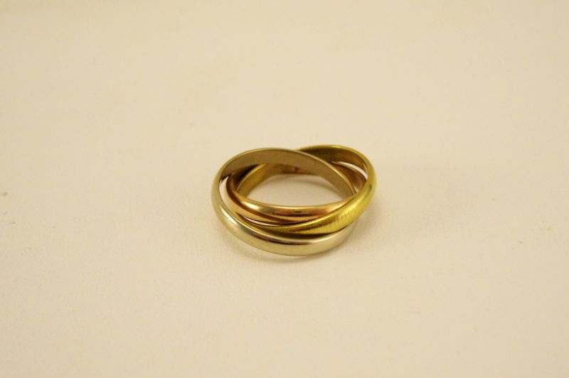 Appraisal: kt Gold Interlocked Cartier Rings Three gold bands one yellow