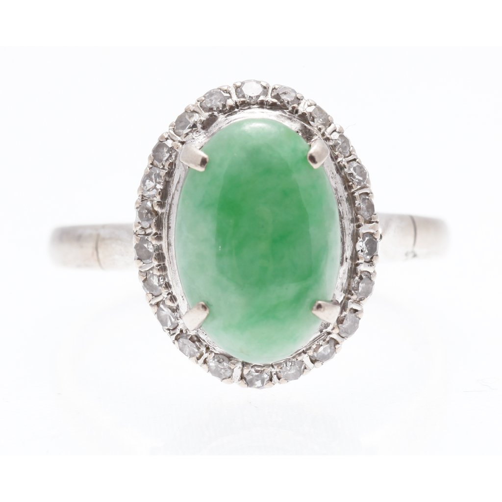 Appraisal: A jade and diamond set cluster ring claw set with