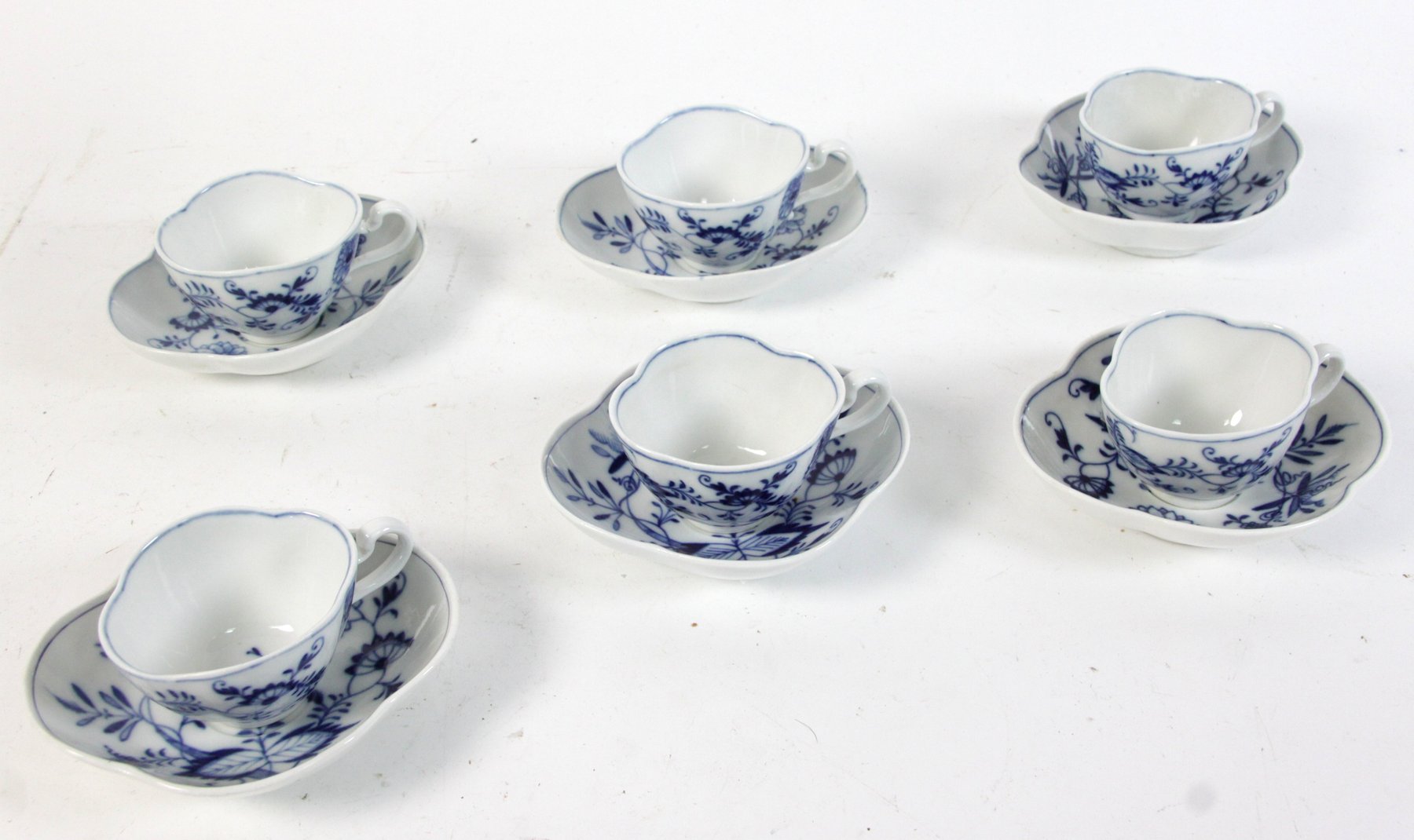 Appraisal: Six Meissen onion pattern tea bowls and saucers